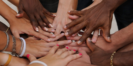 Diverse human hands showing unity