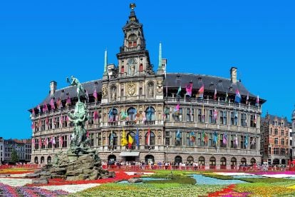 Antwerp town hall with colourful flags