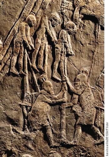 7th century BC Assyrian relief held in the British Museum showing Assyrian soldiers impaling enemies during the siege of Lachish