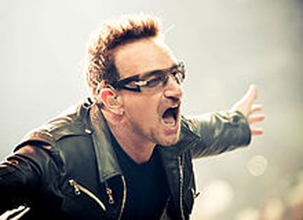 Bono performing in a live concert with Irish rock-band U2