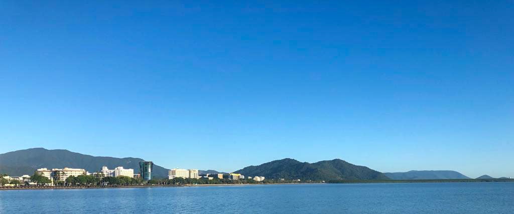 Cairns township and harbour with big sky background - World Transformation Movement North Queensland image