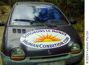 Car with sticker on bonnet ‘Soignons le monde’ (‘Fix The World’ in French)