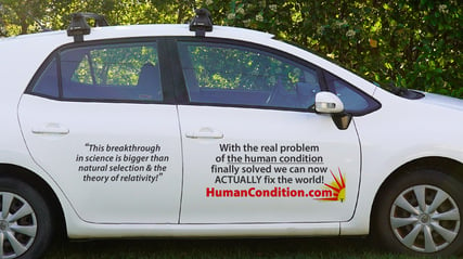 A car with decal stickers on the side doors promoting HumanCondition.com