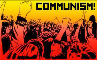 People marching in protest with fists raised and the slogan ‘COMMUNISM!’