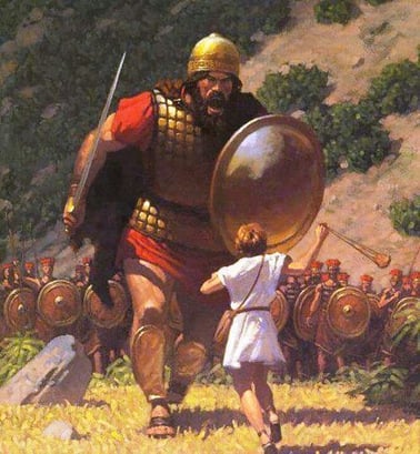 A giant soldier wielding a sword joins battle with a boy with a throwing sling depicting the biblical story of David and Goliath