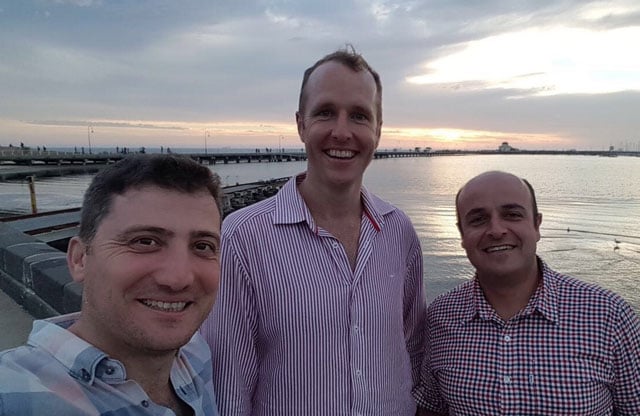 World Tranformation Movement Members Sam, Frank and Sam stanidng on a dock in Melbourne