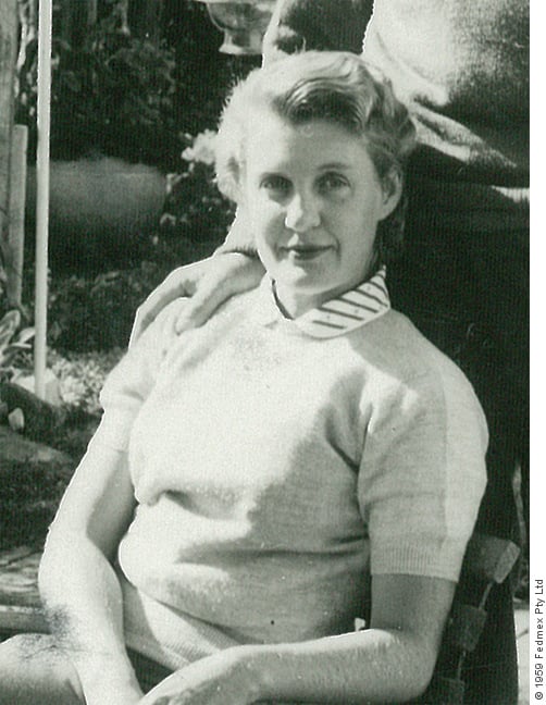 Black & white portrait photograph of Jill Griffith sitting in a chair.