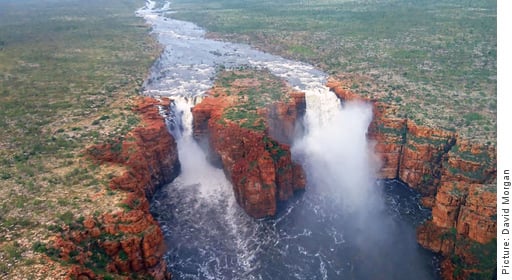 Aerial view of a river and waterfall in full flood, King George Twin Falls in Western Australia’s Kimberley region