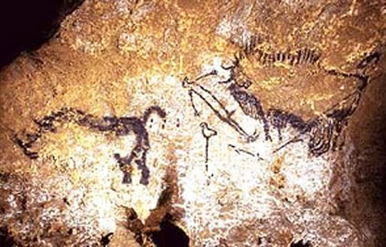 17,300 year old cave painting of a wounded bison, a dead man with a broken spear beside him, a bird and what appears to be a rhinoceros in Lascaux, France.