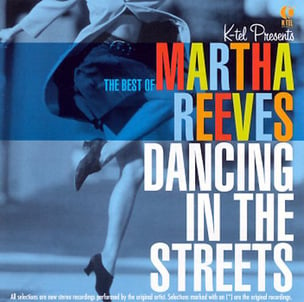 A girl in skirt and heals excitedly dancing on the cover of Martha Reeves’ 1964 ‘Dancing in the Street’ album cover