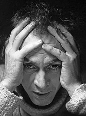Image of R.D. Laing holding head in hands