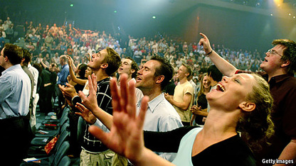 White American Christian churchgoers praying in a state of euphoria