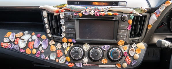 Shell and lure mural created by Jeremy Griffith on the dashboard of his car - July 2019