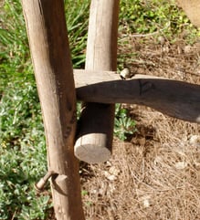 Detail of a single bolt securing the joint of stick furniture chair