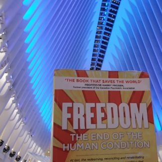 FREEDOM book by Jeremy Griffith in the World Trade Center Oculus building with blue roof in the background