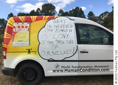 Van with World Transformation Movement branding