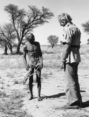 Sir Laurens van der Post with a Bushman in the desert