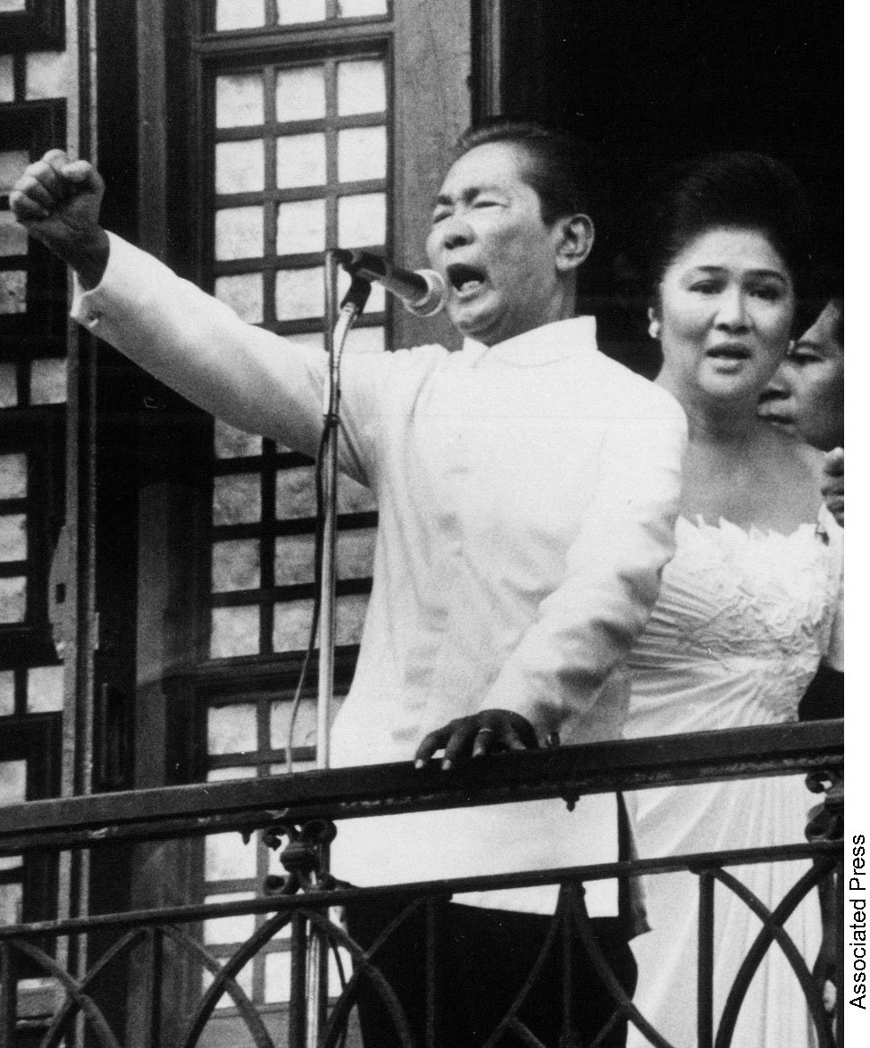 Ferdinand Marcos with his wife Imelda defies the world from the balcony of the Presidential Palace after taking the oath of office as president of the Philippines on February 25, 1986. Elsewhere in Manila on the same day, the representative of the People’s Revolution, Mrs Corazon Aquino, was also being sworn in as president.