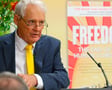 Jeremy Griffith presenting in front of FREEDOM book banner at book launch