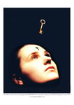 Poster of The Mind's True Liberation with a gold key floating in space, orientated to be inserted in a key hole in the forehead of a woman.