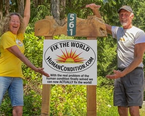 Bill and Cindy McCaugherty with ‘Fix The World’ Sign