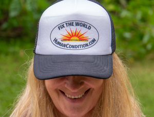 Annie Williams wearing the “Fix The World” Cap