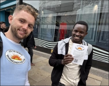 Jack handing out WTM flyers with a friend