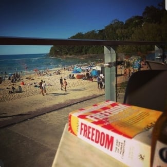 The book 'FREEDOM' at the beach