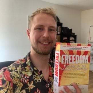 Sven holding his copy of FREEDOM