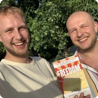 Sven and Ralph holding the book FREEDOM