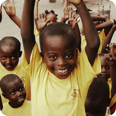 Smiling children with arms raised